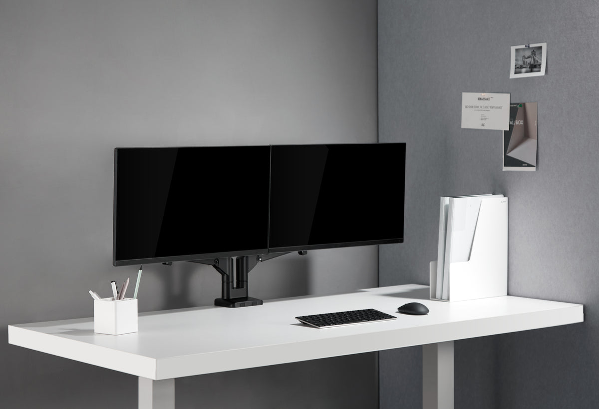 White desk with two monitors mounted on a black dual monitor arm
