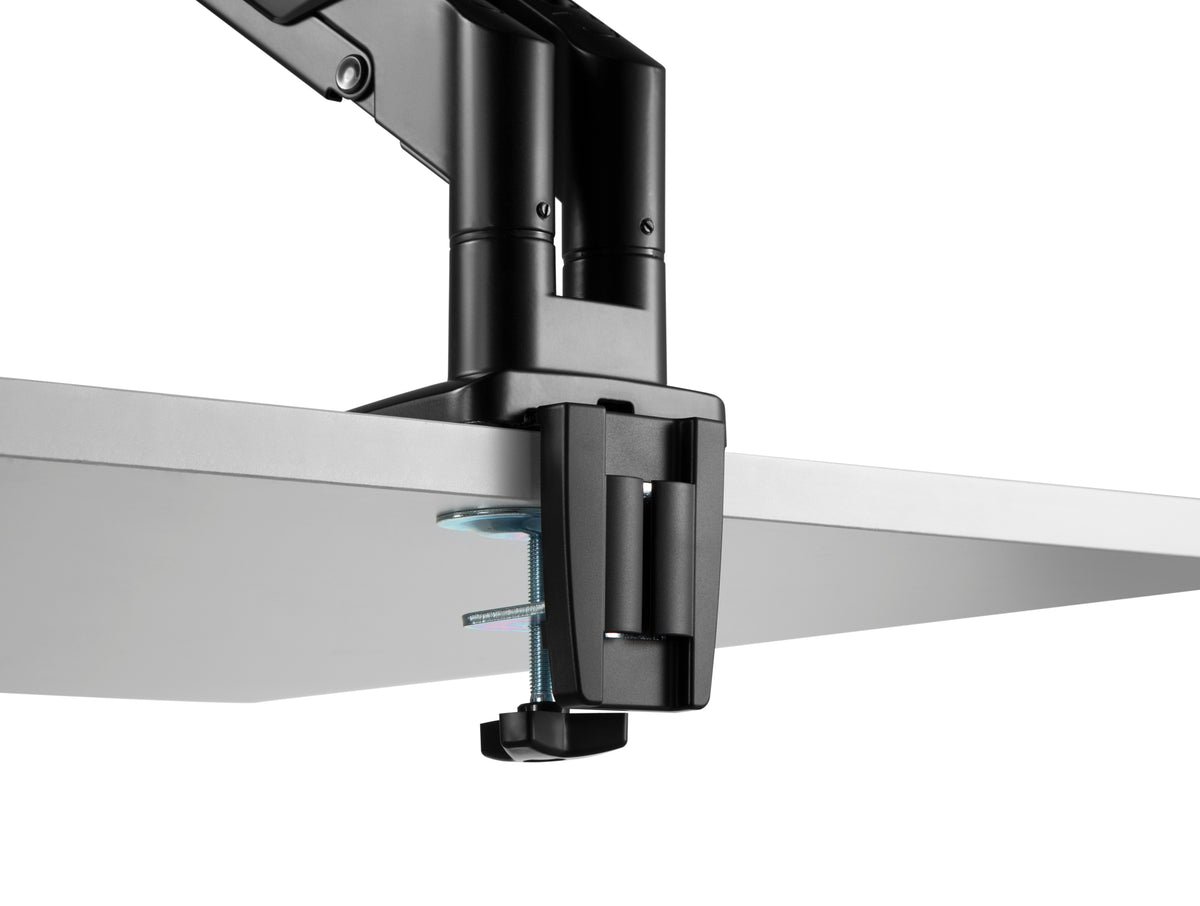 Underside view of the monitor arm desk clamp fitted to a desk edge