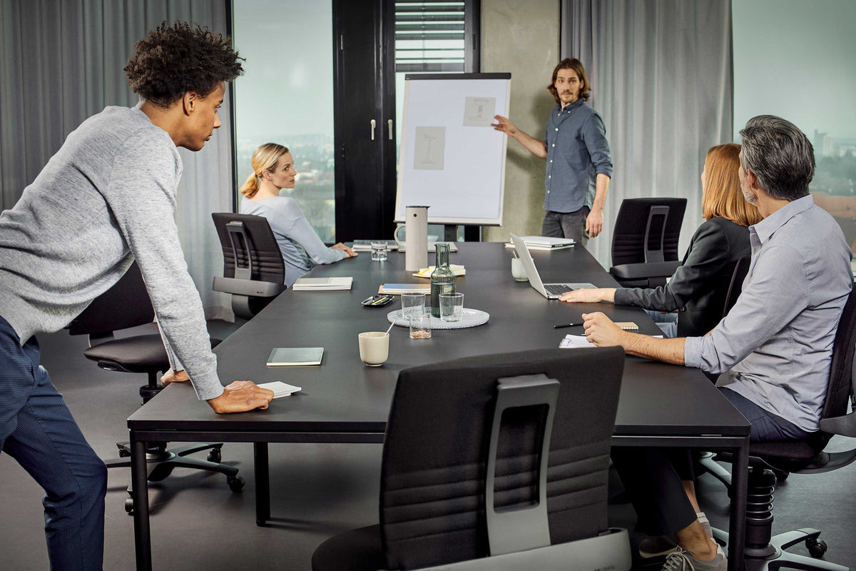 Meeting room with colleagues seated on 3Dee active chairs around a table