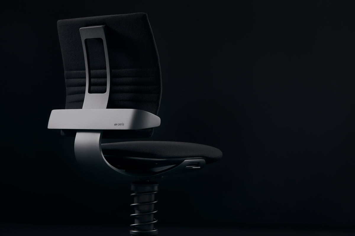 3Dee active chair in black microfibre against a dark background