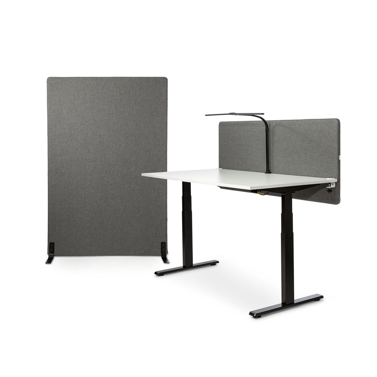 MUTE acoustic floor screens arranged beside a height-adjustable desk