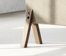 Close-up of an ash coloured wooden floor screen foot supporting a fabric panel