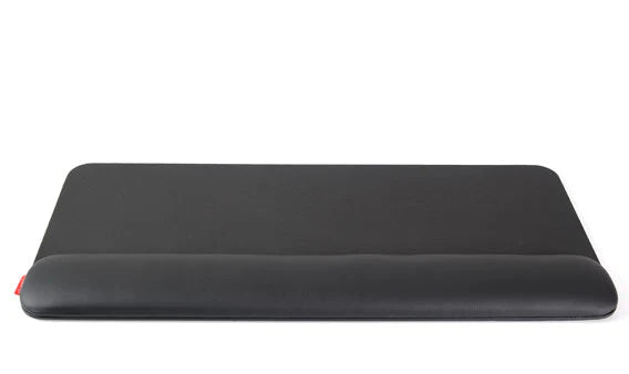 Wide wrist rest in black faux leather seen from above