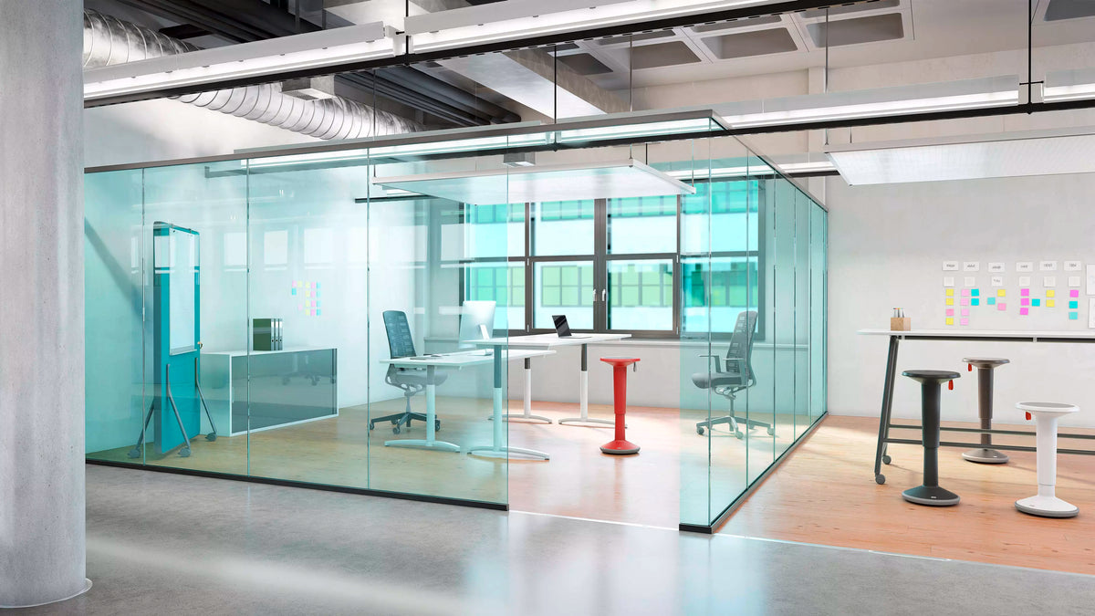 Bright office with UPis1 active chairs beside height-adjustable desks
