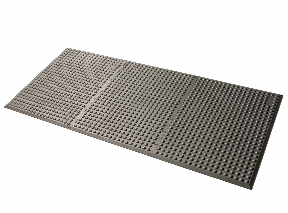 Grey GetUpMat Puzzle extension piece for customizable standing mats, extends mat by 47 cm for flexible workspace use.