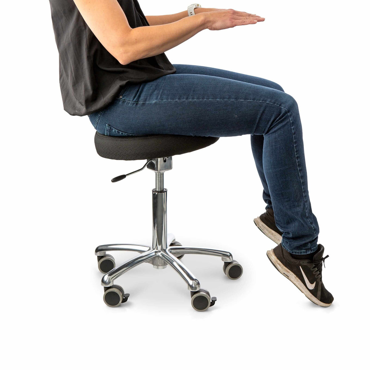 Person seated on an Active Balance 360 active chair with arms outstretched