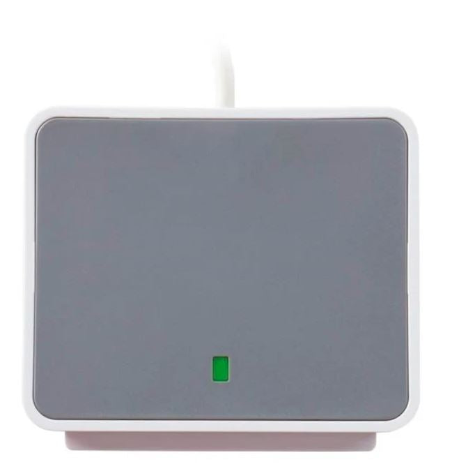 USB smart card reader seen from above, showing the green status light