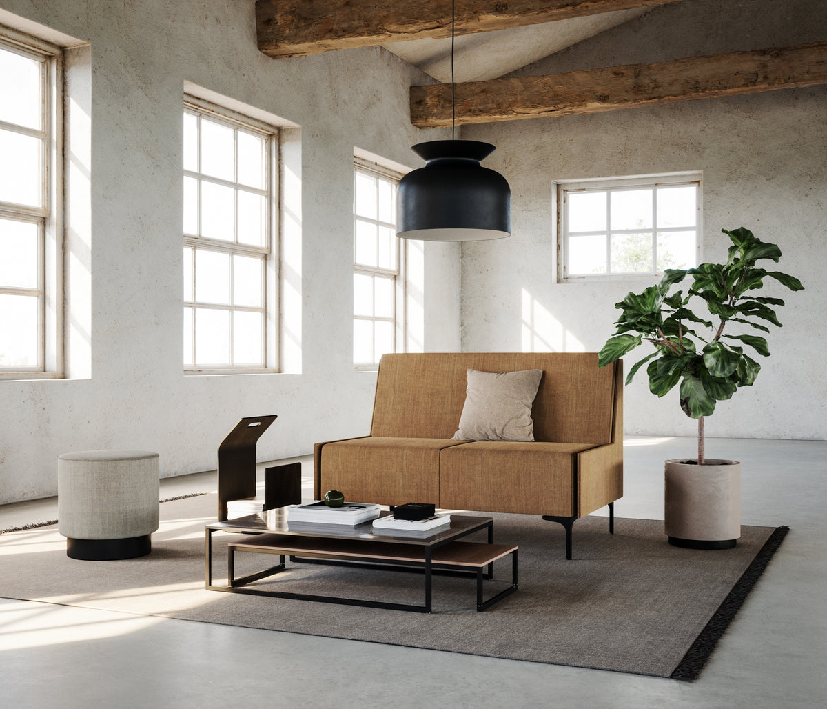 Focus modular sofa two-seater in tan upholstery in a loft lounge with a plant