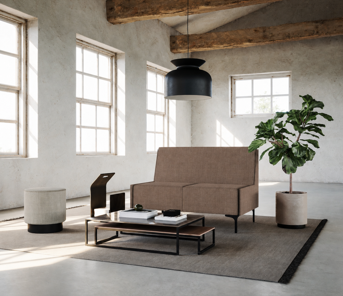 Focus two-seater sofa in brown Savio upholstery in a loft lounge with large windows and a plant