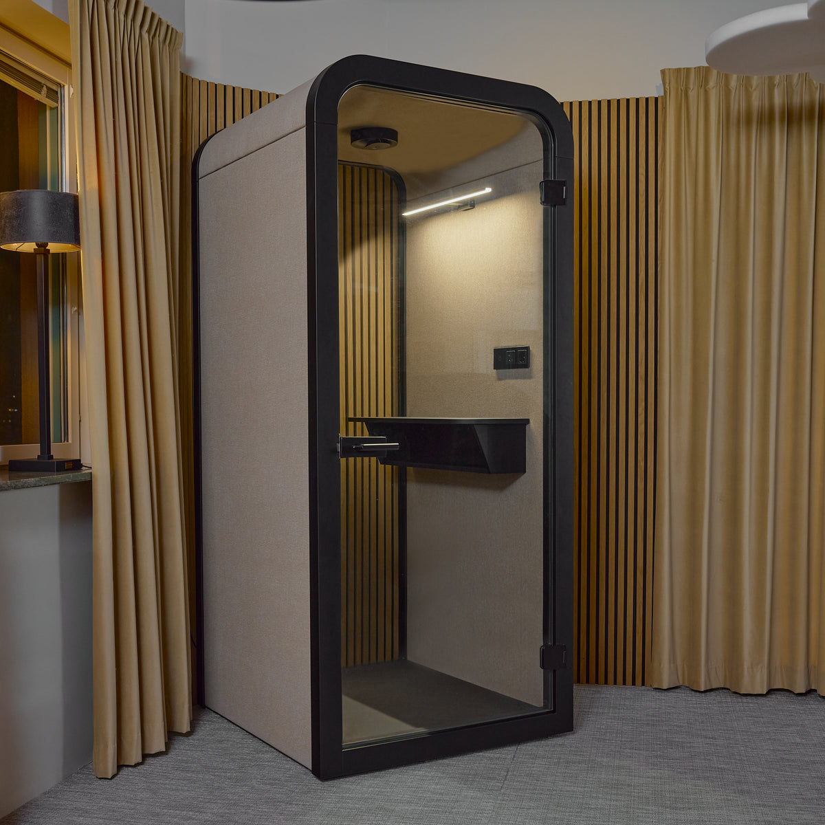 Focus Pod phone booth seen from outside with the glass door closed