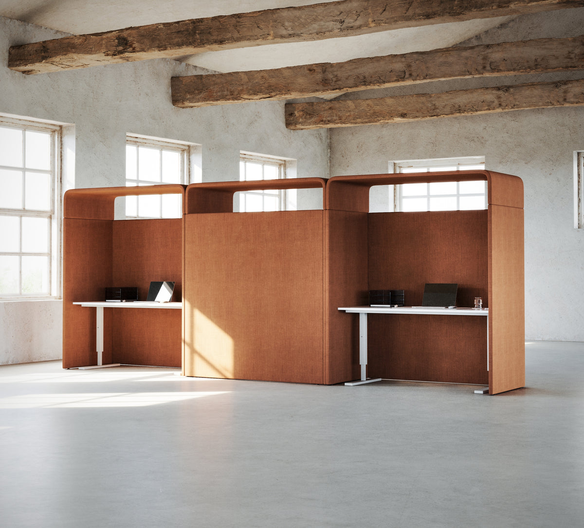 Focus Cube work booth in a loft office with tall windows