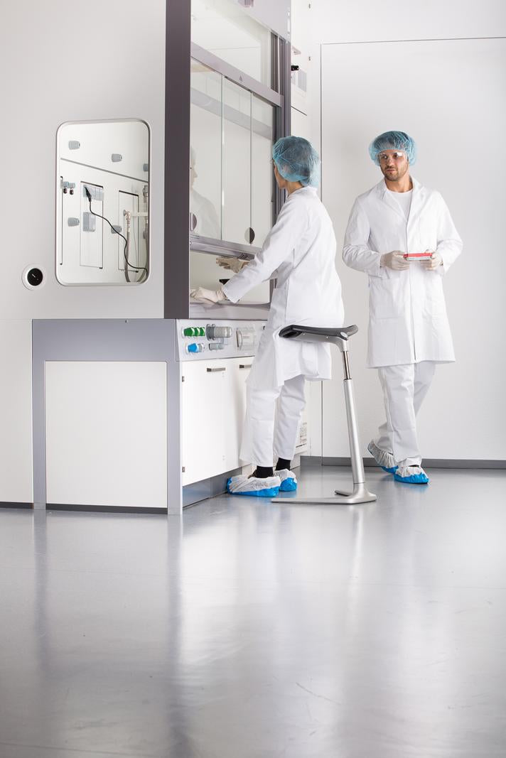 Clean room corridor with staff and an ESD protected FIN leaning chair