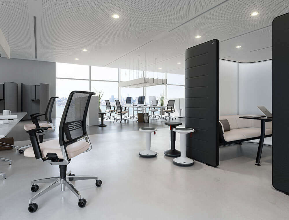 Bright office interior with a UPis1 active chair beside a task chair