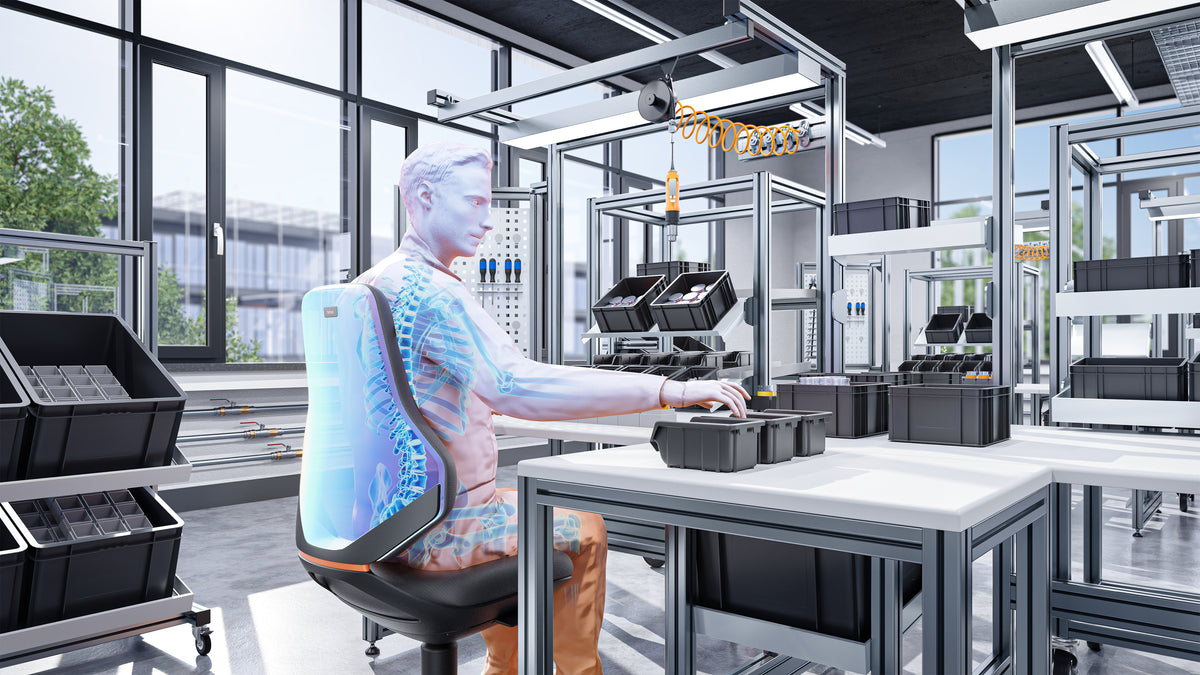 Worker in protective clothing seated on a Texon work chair at a bench