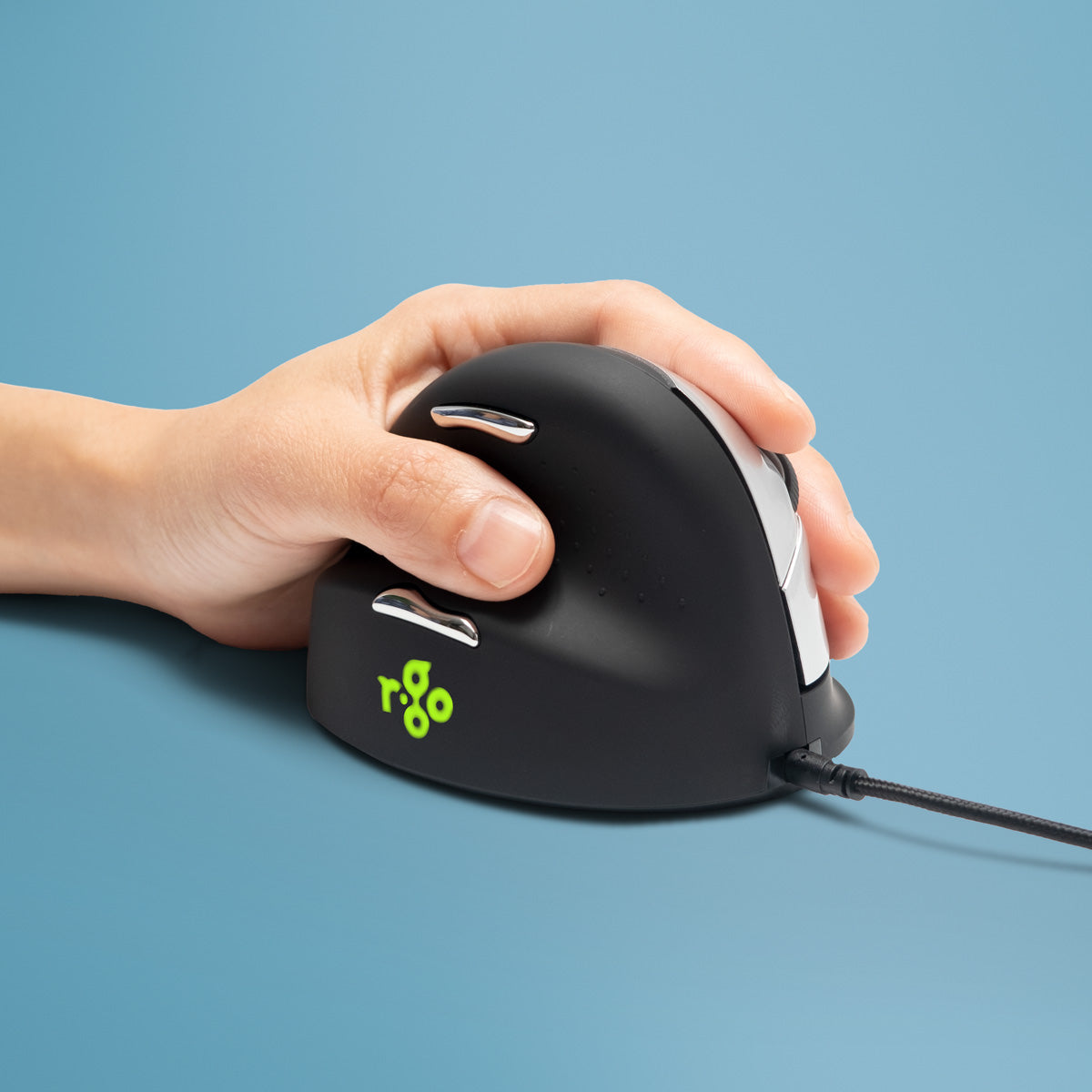 Hand using an HE Mouse left-handed vertical mouse against a blue background