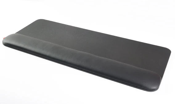 Wide wrist rest in black faux leather, shown at an angle