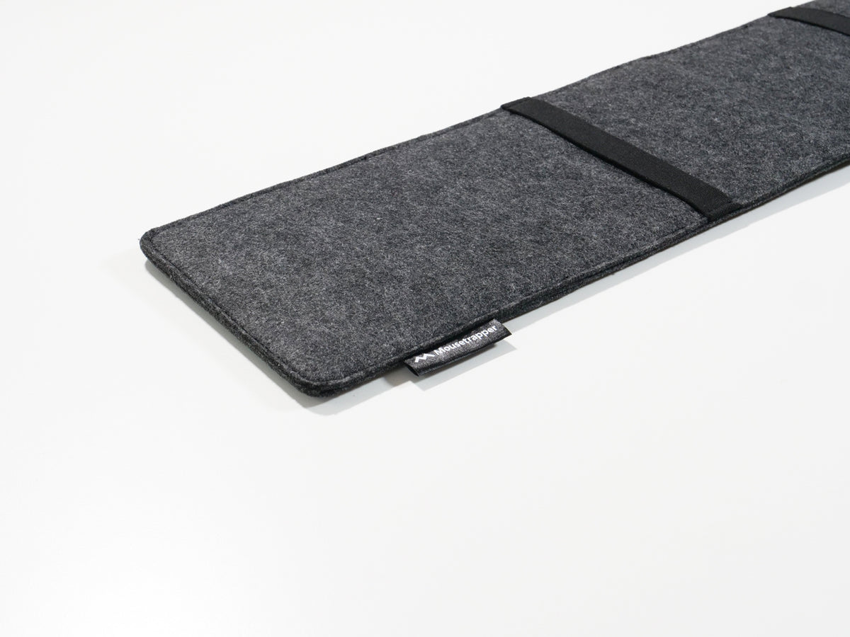 Grey felt laptop sleeve opened flat to show the interior