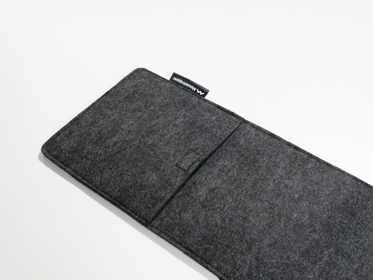 Grey felt laptop sleeve lying flat with a carry handle, seen from above