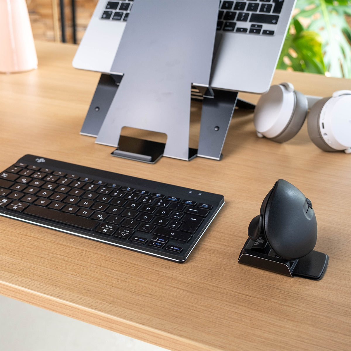 Desk setup with a keyboard, laptop stand and R-Go Twister ergonomic mouse