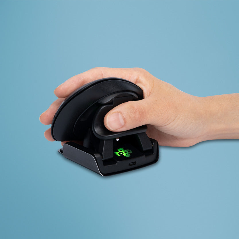 Hand resting on an R-Go Twister ergonomic mouse to show the grip position