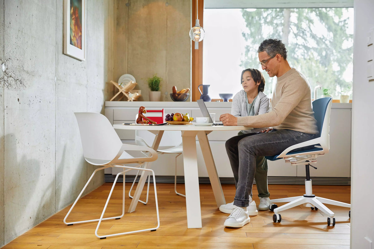 People sitting at a cafe table on Numo Task active chairs