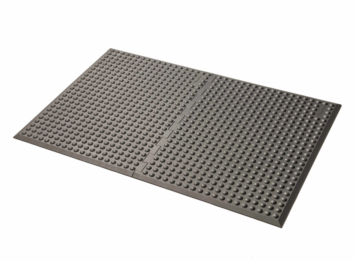 Grey GetUpMat Puzzle workstation standing mat for ergonomic comfort and customizable length in office settings.