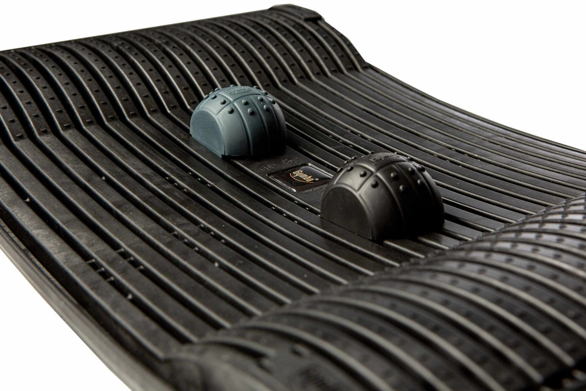 Black Gymba activation board close-up showcasing textured surface and patented elasticity for workplace movement and health benefits.