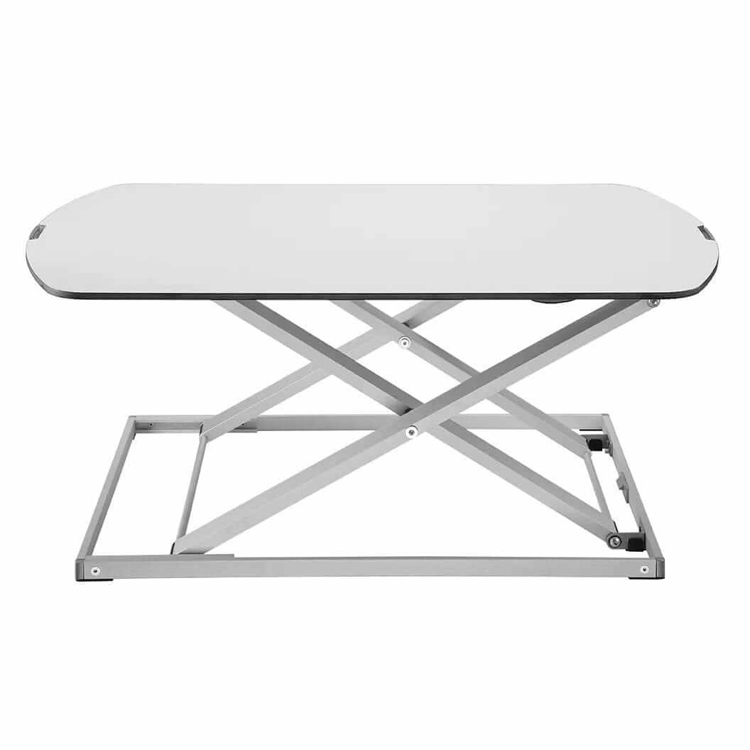 GetUpDesk Free tabletop shown at mid height on its scissor frame