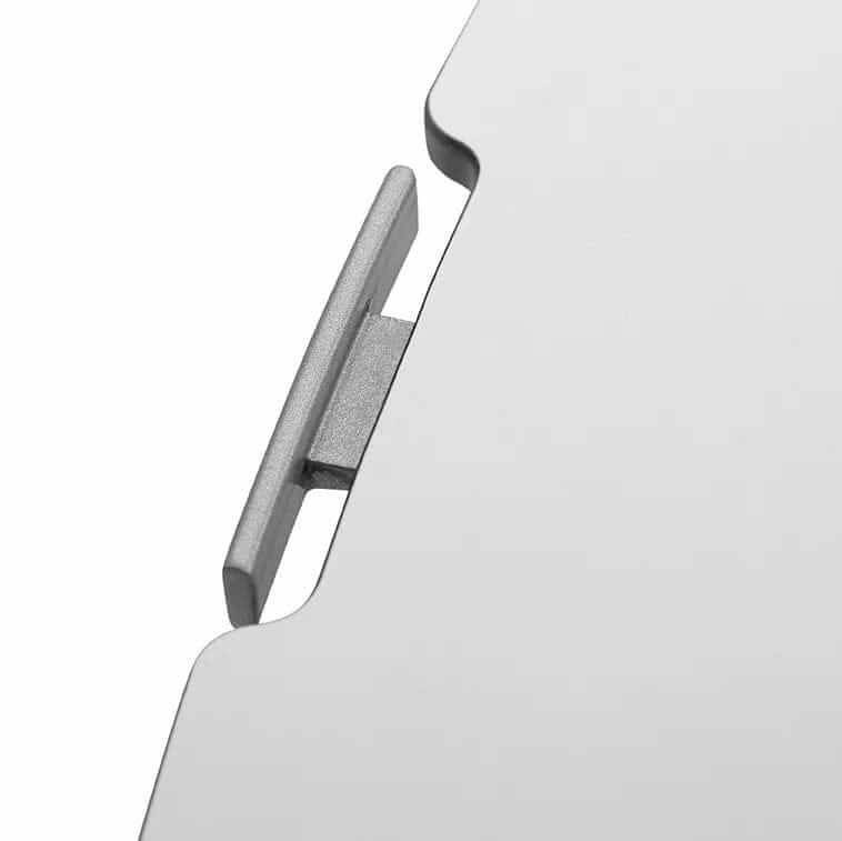 Close-up of the white edge and lifting handle on the GetUpDesk Free tabletop