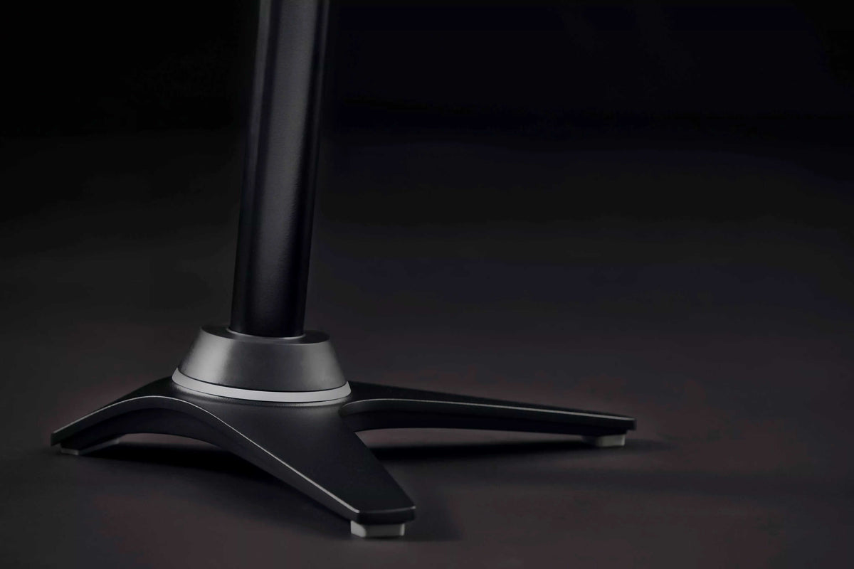 Muvman Industry active chair base with high gas spring for ergonomic support in industrial settings, shown in sleek black design.